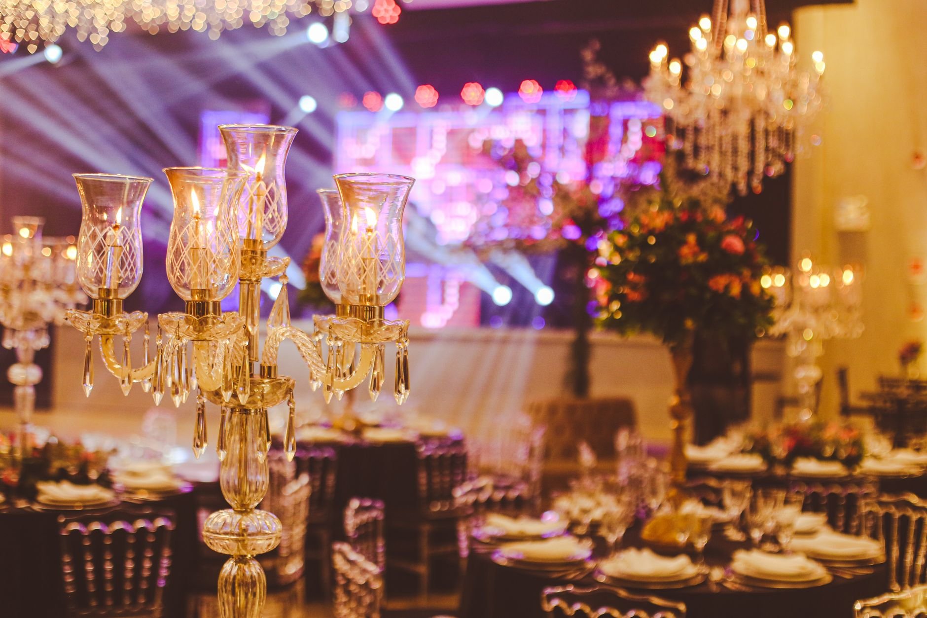 An elegant ballroom setup with crystal candelabras and luxurious decorations, perfect for a grand celebration.